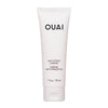 A white tube of OUAI Anti-Frizz Crème, designed for hair care.