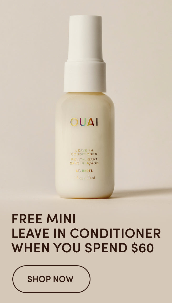OUAI Leave In Conditioner bottle in a warm cream color with a white spray top, set against a solid beige background with promotional text below.