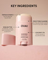 OUAI deodorant stick with key ingredients on a beige background