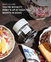 Ouai product on a table with tea set and snacks