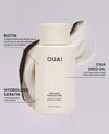 OUAI conditioner bottle with text detailing ingredients on a light gray background