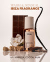 OUAI fragrance mist bottle with vanilla, cocoa, and rum elements on a reflective surface.