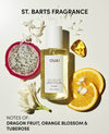 OUAI hair and body mist with dragon fruit, orange slices, and flowers on a light background