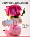 Oua fragrance bottle with pink flowers on a light background