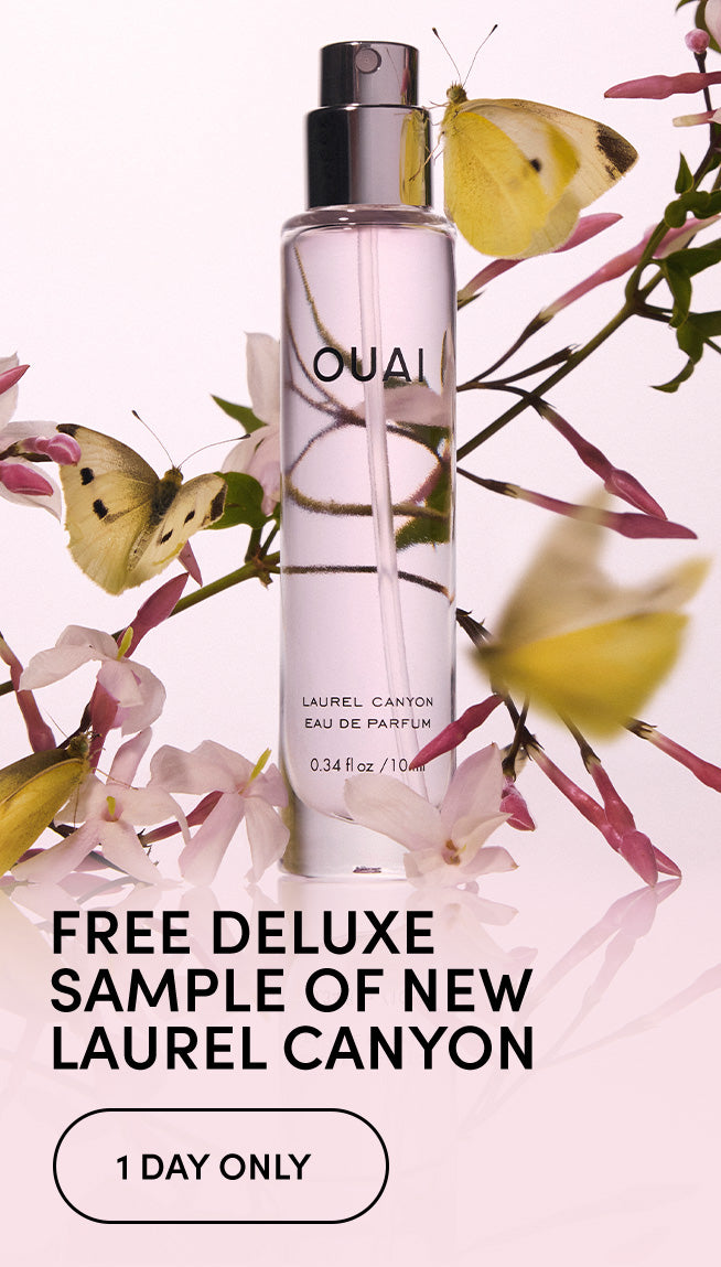 A perfume bottle labeled OUAI with a silver pump, surrounded by pink flowers and yellow butterflies on a pale pink background, with promotional text reading 'FREE DELUXE SAMPLE OF NEW LAUREL CANYON' and '1 DAY ONLY'.