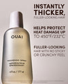 OUAI Thickening Spray bottle in a metallic champagne gold finish with a white cap, shown on a light beige background with promotional text highlighting heat protection and thicker hair results.