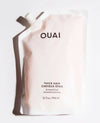 OUAI Thick Hair Shampoo refill pouch in a pale pink color, featuring black text and a white spout, photographed on a clean white background with a soft shadow.