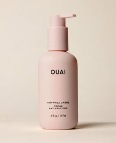 OUAI Anti-Frizz Crème 6 fl oz pump bottle in soft pink.