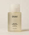 A travel-sized translucent OUAI Fine Hair Shampoo bottle stands upright against a cream studio background. Text: “OUAI”, “FINE HAIR”, “CHEVEUX FINS”, “SHAMPOO”, “SHAMPOOING”, “3 fl oz / 89 ml”.