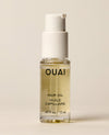 A small clear OUAI Hair Oil pump bottle containing pale yellow liquid stands on a cream studio surface. Text: “OUAI”, “HAIR OIL”, “HUILE CAPILLAIRE”, “.45 fl oz / 13 ml”.